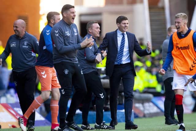Steven Gerrard and the rest of the Rangers bench celebrate Scott Arfield's goal. Picture: SNS Group