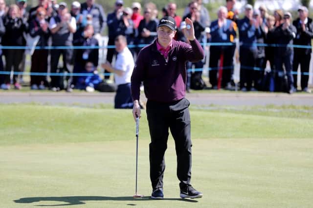 Bob Macintyre acknowledges the crowd after his birdie at the 18th. Picture: PA.