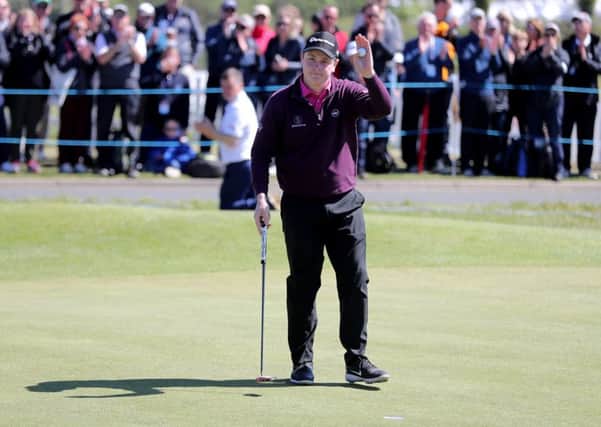 Bob Macintyre acknowledges the crowd after his birdie at the 18th. Picture: PA.
