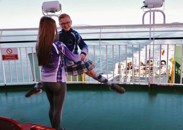 Harry Aiken, Highland Dancer with the Anne McIlroy School of Dance warming up whilst on his way to the Gourock Highland Games, on the ferry going from Rothesay to Wemyss Bay. Photo by Iain Cochrane.