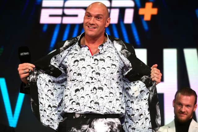Tyson Fury shows off his shirt featuring drawings of former world heavyweight champions. Picture: Kirsty O'Connor/PA Wire