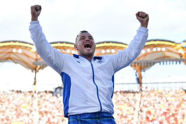 Mark Dry celebrates winning bornze in the men's hammer throw final at the 2018 Gold Coast Commonwealth Games. Picture: AFP/Getty Images