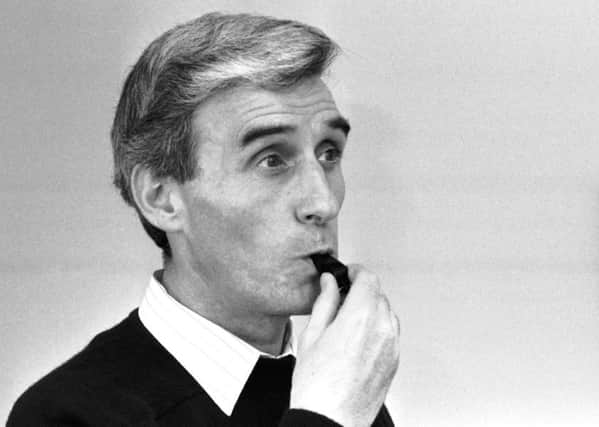 Edinburgh football referee George Smith practices blowing his whistle after being picked to referee in World Cup 1990.