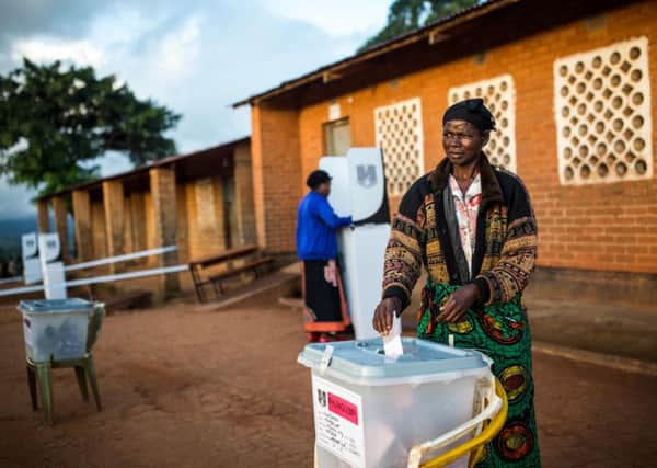 A woman casts her vote at Masasa Primary School polling station in Mzuzu on 21 May (Picture: Patrick Meinhardt/AFP/Getty)