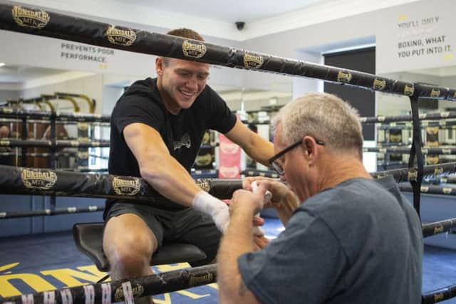 World-renowned trainer Freddie Roach tapes up the right hand of Ivan Baranchyk as the Belarusian prepares to face Josh Taylor. Picture: SNS