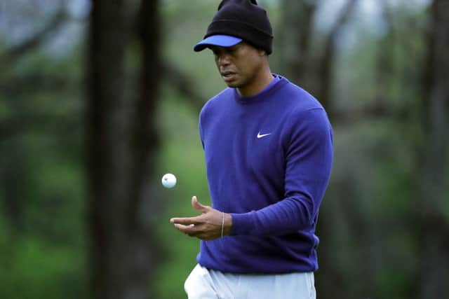 Tiger Woods flips his ball as he walks along the ninth green during a practice round for the US PGA Championship. Picture: Julie Jacobson/AP