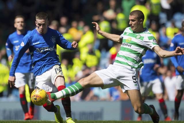 Jozo Simunovic tackles Ryan Kent during Sunday's Old Firm clash. Picture: SNS