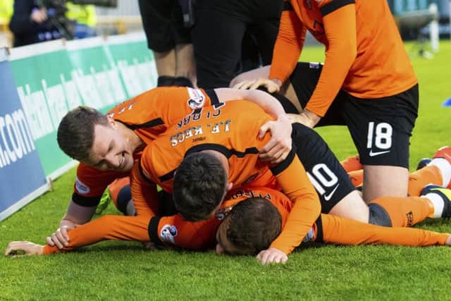 Paul McMullan is mobbed by his Dundee United team-mates after scoring the only goal against Inverness Caley Thistle. Picture: Bill Murray/SNS