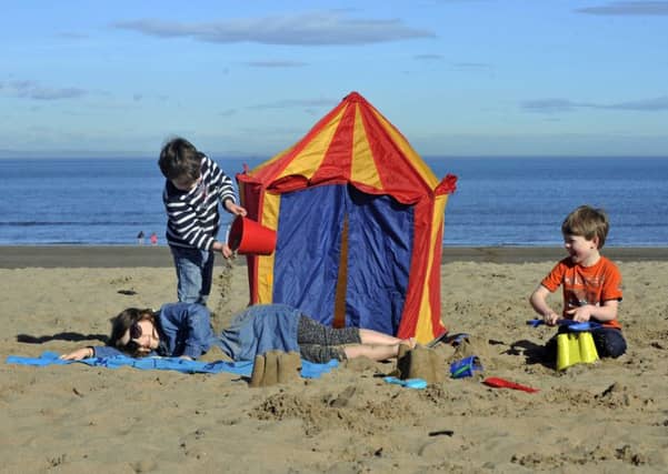 Children play on Portobello Beach as Scotland enjoys its hottest day of the year. Picture: Phil Wilkinson