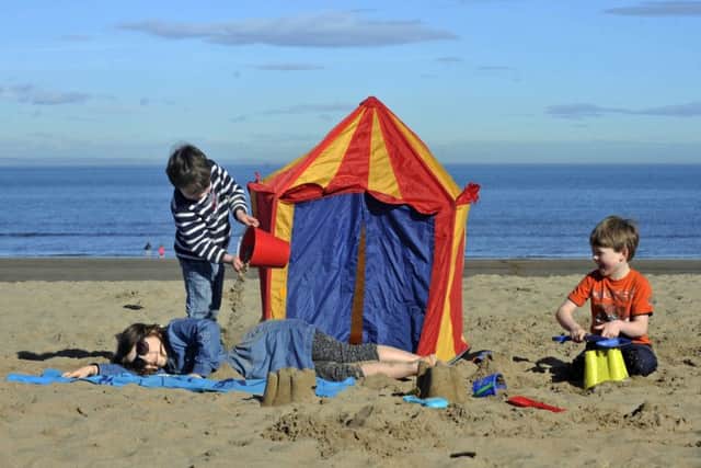 Children play on Portobello Beach as Scotland enjoys its hottest day of the year. Picture: Phil Wilkinson