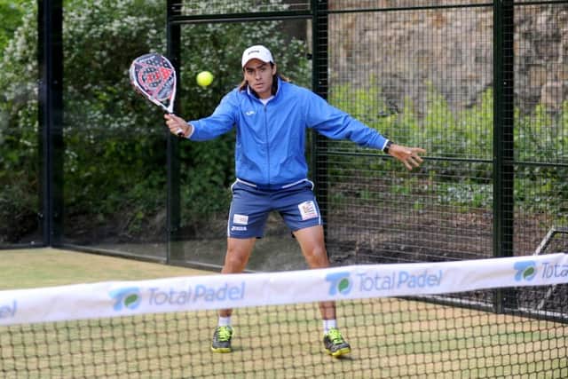 Padel tennis takes place in an enclosed court similar to squash. Picture: Jane Barlow