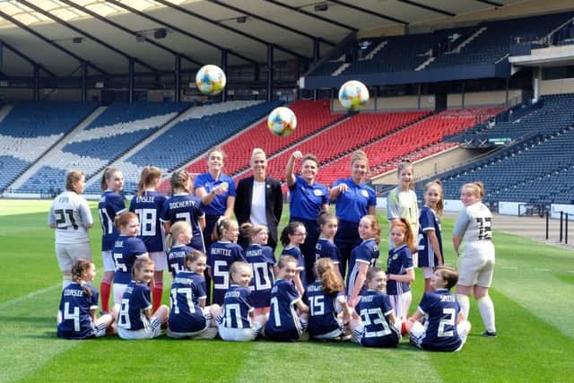 Scotland's Lee Alexander, manager Shelley Kerr, Joanne Love and Nicola Docherty with young fans at Hampden Park. Picture: Lorraine Hill