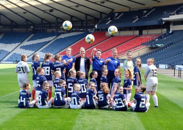 Scotland's Lee Alexander, manager Shelley Kerr, Joanne Love and Nicola Docherty with young fans at Hampden Park. Picture: Lorraine Hill
