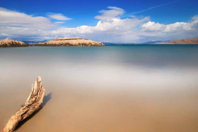 On the West coast of Scotland, north of Fort William, you'll find the beach of Morar. Famous for its stunning silver sands and crystal clear turquoise water, the beach has shallow water to paddle in.