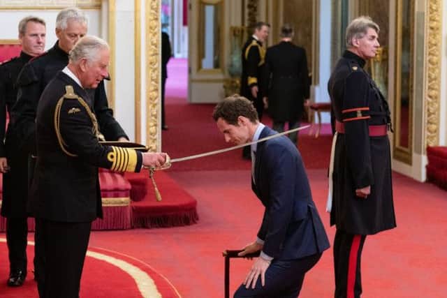 Andy Murray receives his knighthood from the Prince of Wales during an investiture ceremony at Buckingham Palace. Picture: Dominic Lipinski/PA Wire