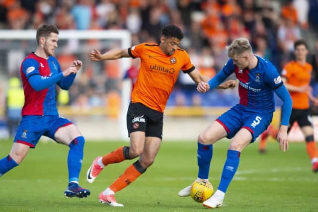 Osman Sow takes on Inverness defender Coll Donaldson during Dundee Uniteds 1-0 victory in the first leg of their play-off semi-final at the Caledonian Stadium on Tuesday. Picture: SNS