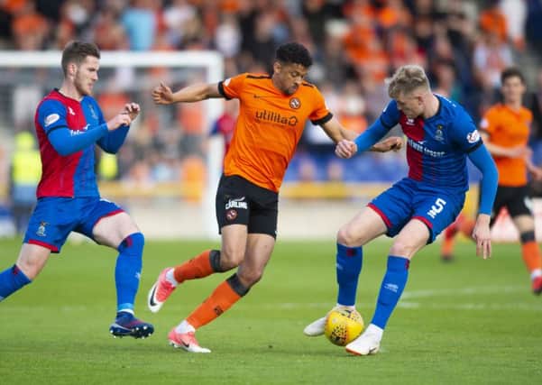 Osman Sow takes on Inverness defender Coll Donaldson during Dundee Uniteds 1-0 victory in the first leg of their play-off semi-final at the Caledonian Stadium on Tuesday. Picture: SNS