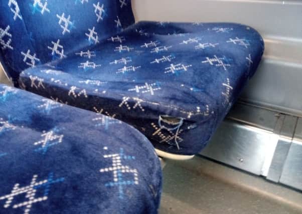 Ripped seat on a ScotRail train spotted by the inspectors. Picture: The Scotsman