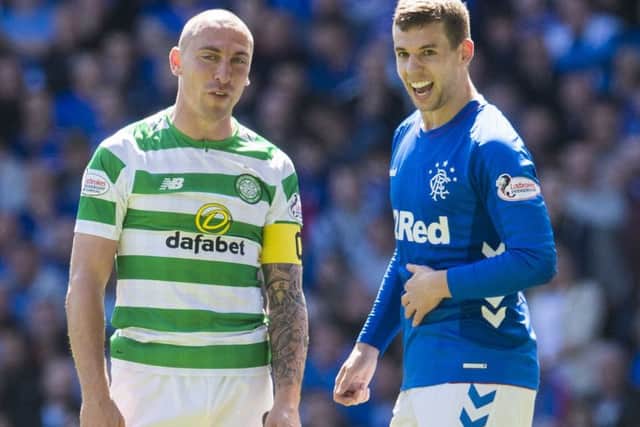 Celtic's Scott Brown and Rangers' Jon Flanagan. Picture: SNS
