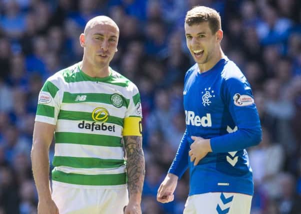 Celtic's Scott Brown and Rangers' Jon Flanagan. Picture: SNS