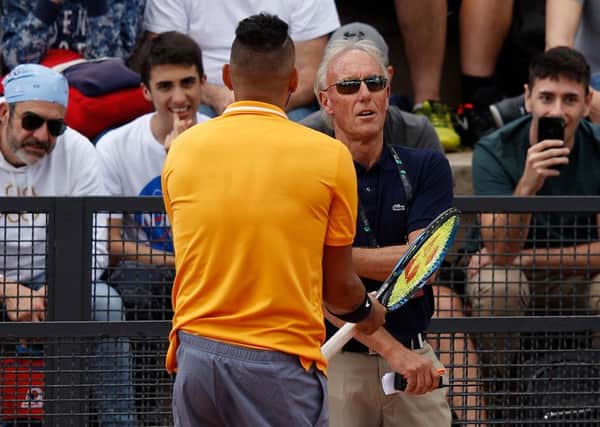 Australia's Nick Kyrgios argues with tournament umpire Gerry Armstrong in Rome. Picture: Adam Pretty/Getty Images