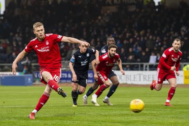 Derek McInnes faith in Sam Cosgrove has been repaid  and the striker is relieved the boss is staying put. Photographs:  Ross Parker/SNS