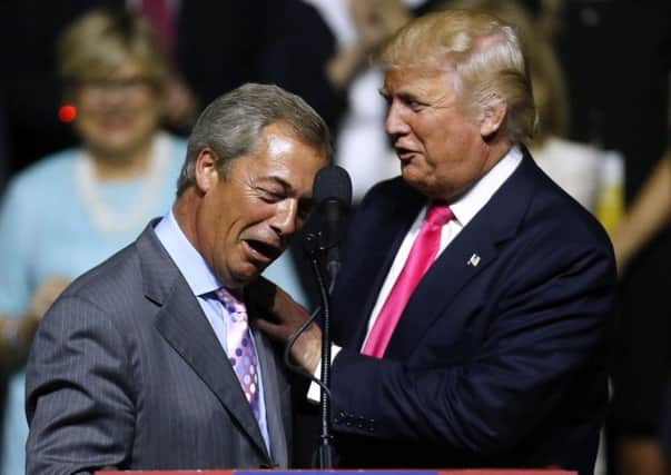 Donald Trump greets Nigel Farage during a campaign rally in Jackson, Mississippi, in 2016 (Picture: Jonathan Bachman/Getty Images)