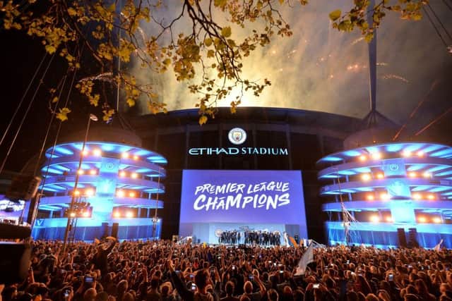 Champagne days at the Etihad Stadium  but some fans who remember the lower division years still fear their superstar team is capable of imploding. Picture: PA.