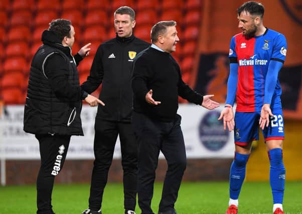 Inverness boss John robertson discusses the penalty incident with Brad McKay, while assistant manager Scott Kellacher speaks to fourth official David Lowe. Picture: Alan Harvey/SNS