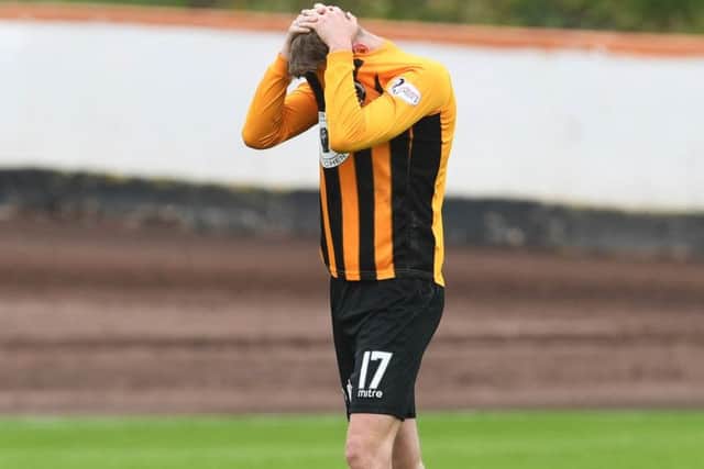 Its all too much for Grant Rose as the final whistle signals Berwicks demise following the 7-0 aggregate defeat by Cove Rangers. Picture: SNS