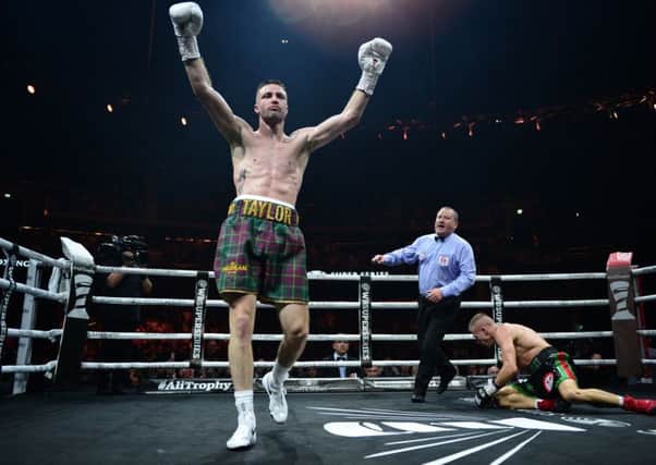 Josh Taylor reacts as he knocks down Ivan Baranchyk in the sixth round in Glasgow. Picture: Getty.