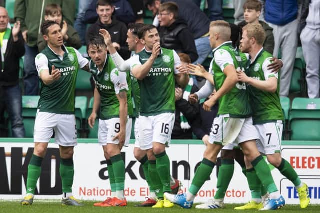 Hibernian's Marc McNulty celebrates his goal with his teammates. Pic: SNS