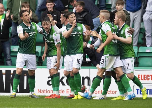 Hibernian's Marc McNulty celebrates his goal with his teammates. Pic: SNS