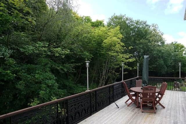 New owners can enjoy good weather on the large wrap around deck.