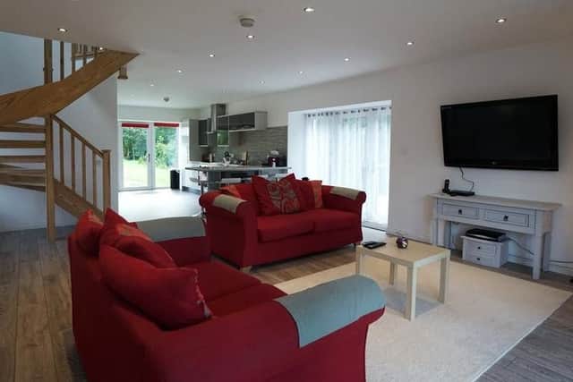 The living room and kitchen are the heart of the home.