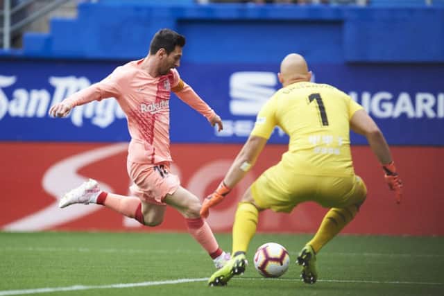 Lionel Messi scoring against Eibar on Sunday. Picture: Getty