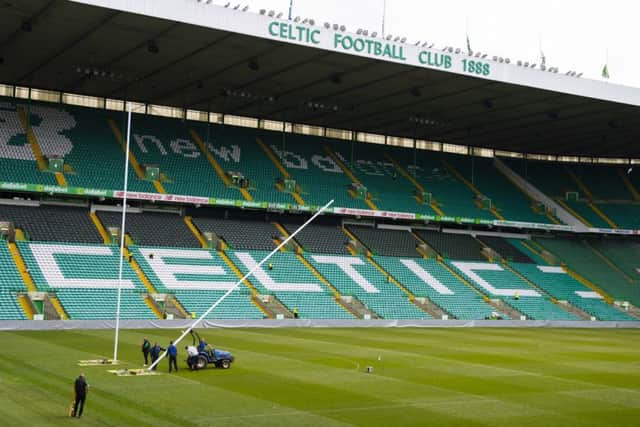 The rugby goalposts being erected.