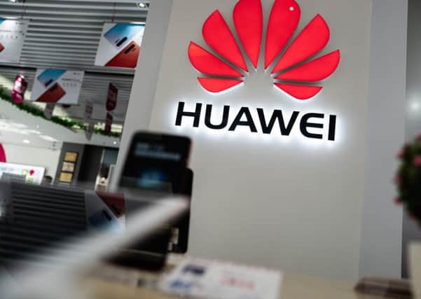 Huawei is a world leader in 5G technology but concerns remain over the potential for spying by China (Picture: Fred Dufour/AFP/Getty Images)