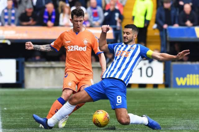 Ryan Jack, challenged by Kilmarnocks Gary Dicker on Sunday, says Rangers cant just turn up and think they are going to win. Picture: SNS.