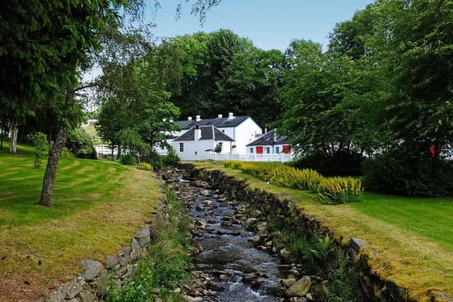 The self titled 'smallest whisky distillery' in Scotland also might be one of its prettiest, with its collection of small white farm buildings, white picket fences and flowing stream.