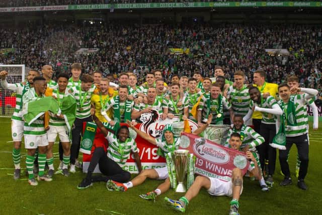 Celtic's players celebrate with the Ladbrokes Premiership trophy - but is the squad too big? Picture: SNS