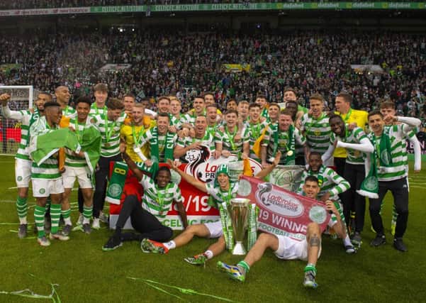 Celtic's players celebrate with the Ladbrokes Premiership trophy - but is the squad too big? Picture: SNS