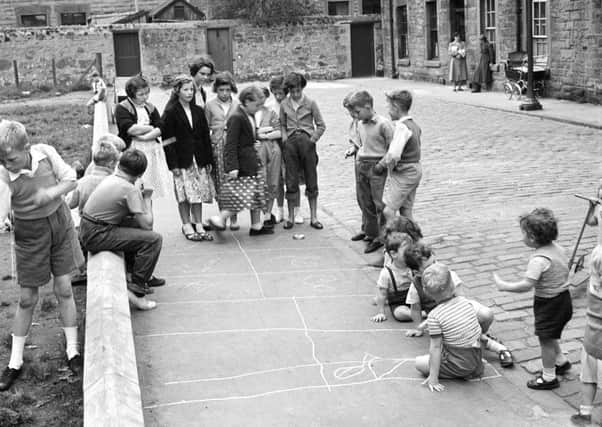 A long and well-established right: children playing peevers in Lapicide Place in Leith in 1957