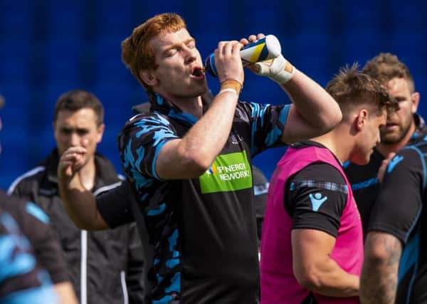 Glasgow Warriors' Rob Harley rehydrates during training for the Pro14 final. Picture: SNS