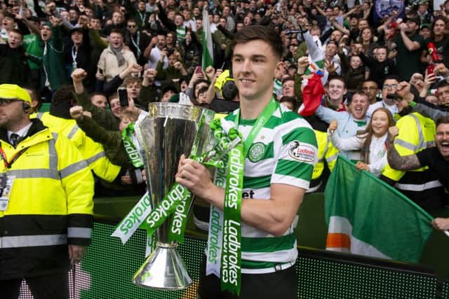 19/05/19 LADBROKES PREMIERSHIP
CELTIC v HEARTS
CELTIC PARK - GLASGOW
Celtic’s Kieran Tierney is pictured with the Ladbrokes Premiership trophy in front of the fans