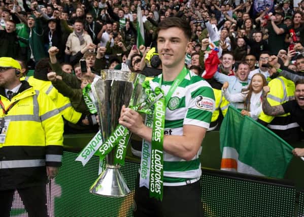 19/05/19 LADBROKES PREMIERSHIP
CELTIC v HEARTS
CELTIC PARK - GLASGOW
Celtic&#x2019;s Kieran Tierney is pictured with the Ladbrokes Premiership trophy in front of the fans