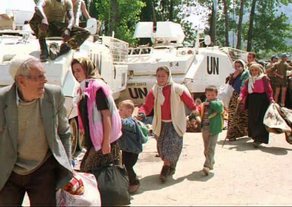 Bosnian Muslim refugees from Srebrenica seek refuge at a UN base in Potocari in July 1995 (Picture: AP)