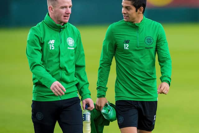 Cristian Gamboa (right) with Jonny Hayes at a training session at Lennoxtown