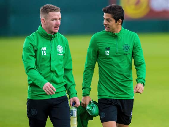 Cristian Gamboa (right) with Jonny Hayes at a training session at Lennoxtown