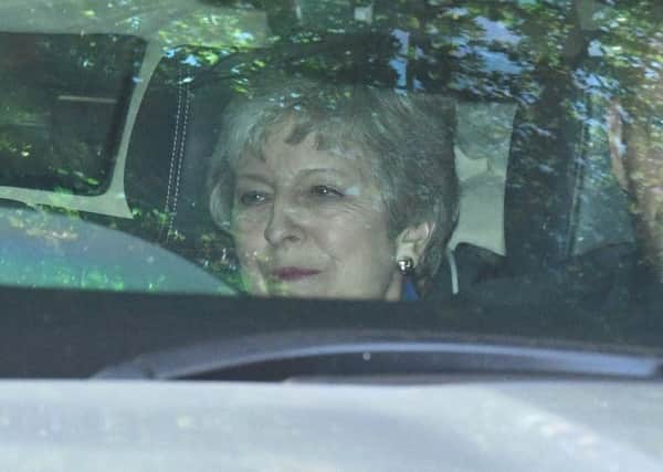 A twinkle, a tear or just a photographers flash in her eye? Theresa May is coming under huge pressure to resign (Picture: Leon Neal/Getty Images)